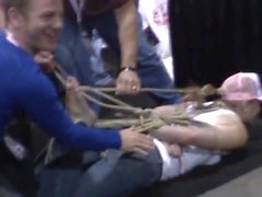 Bondage demo on barefoot girl