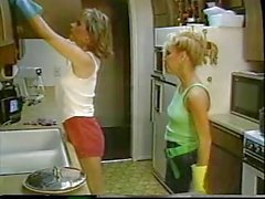 Retro lesbians in passionate action with dildo in the kitchen