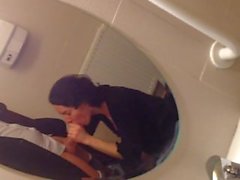 Gorgeous milf sucks a dick in a public toilet and takes a cumshot